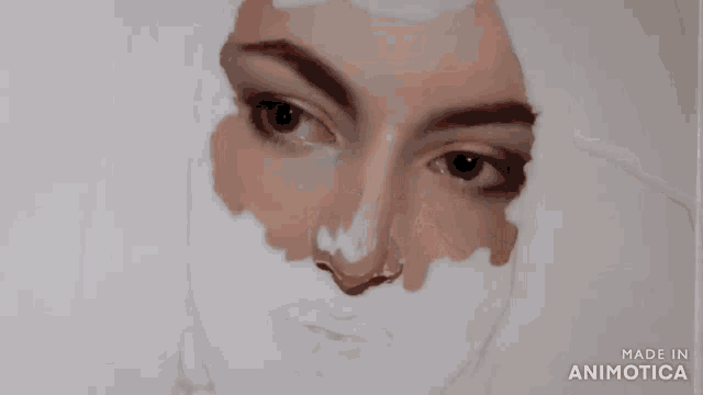 a person is painting a woman 's face with a brush made in animatica