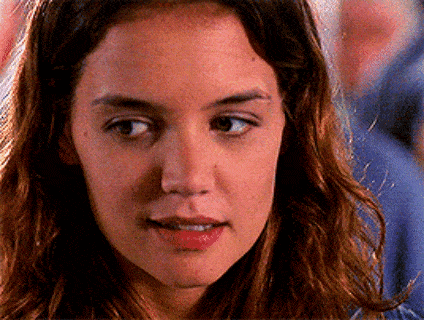 a close up of a woman 's face with her eyes closed and her mouth open .