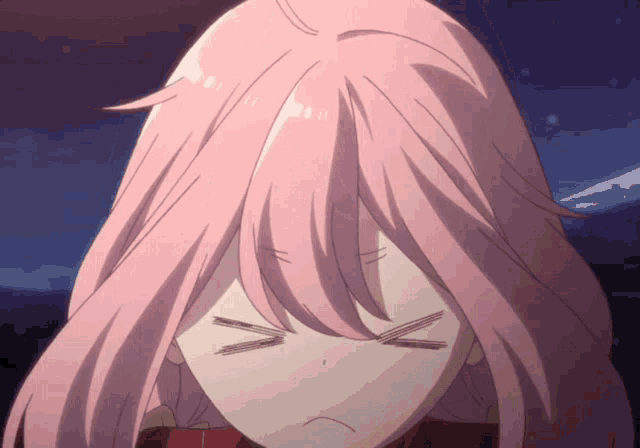 a close up of a girl with pink hair making a face