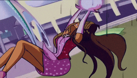 a girl in a pink dress is holding a purple object in her hands