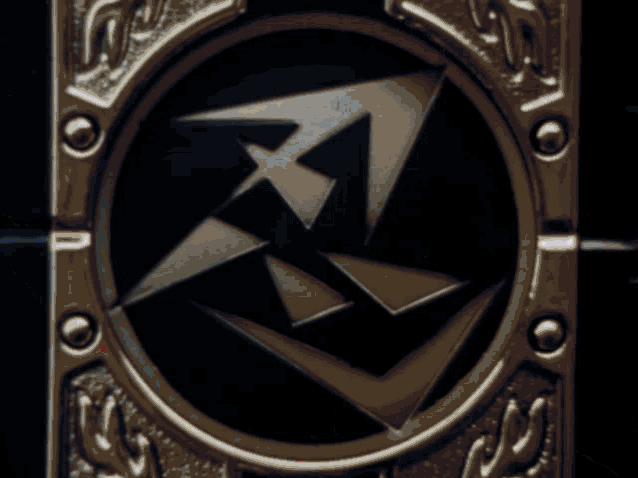 a close up of a gold coin with a pentagon in the center