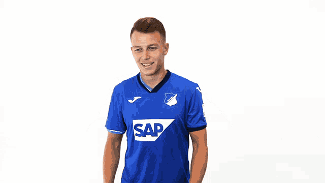 a man is wearing a blue shirt with the word sap on it