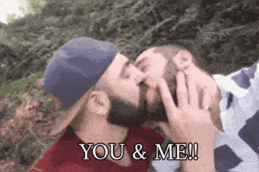 a picture of two men kissing with the words you & me written below them