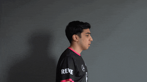 a man wearing a black shirt with the word reve on the sleeves