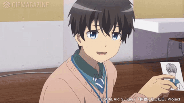 a gif of a boy in a sweater and tie with the words gifmagazine on the bottom