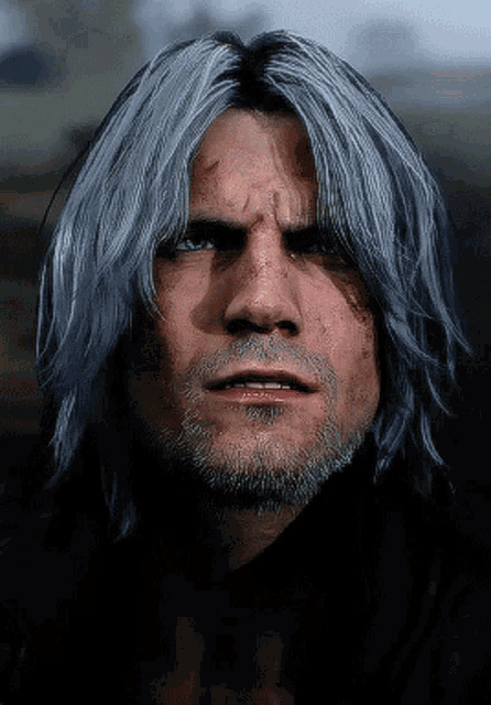 a close up of a man 's face with gray hair