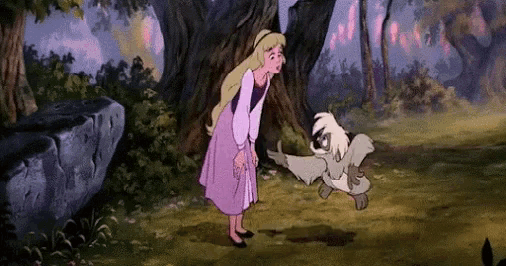 a girl in a purple dress is standing next to a dog in a forest .
