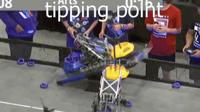 a group of people are standing around a robot with the words tipping point on the bottom