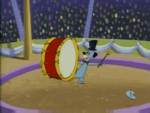 a cartoon character in a top hat is playing a drum in a circus arena