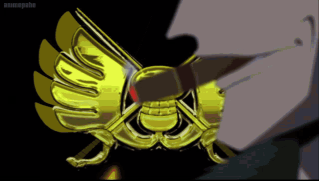 a close up of a gold emblem that says animepahe on the bottom right
