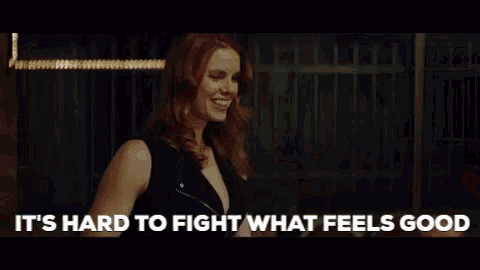 a man is talking to a woman and says `` it 's hard to fight what feels good ''