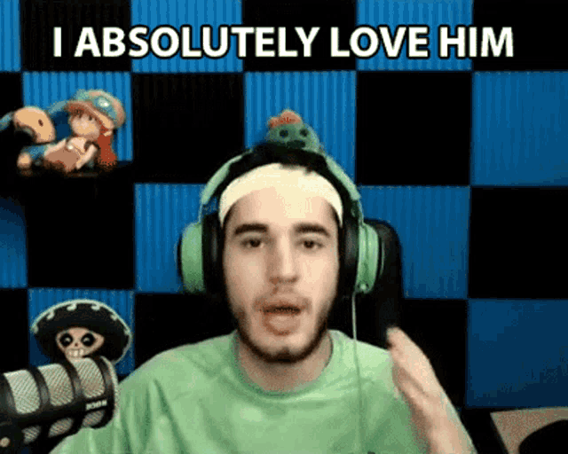 a man wearing headphones and a headband is saying i absolutely love him