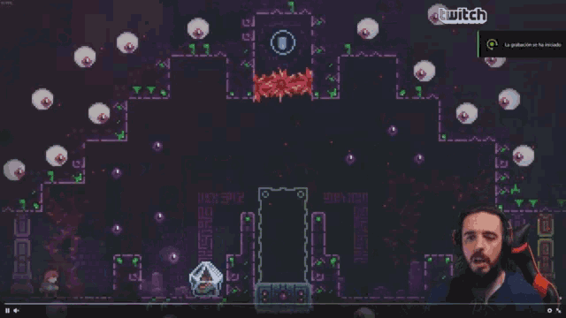 a man playing a video game with a twitch logo in the corner