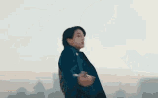 a close up of a person 's face with a blurry background .