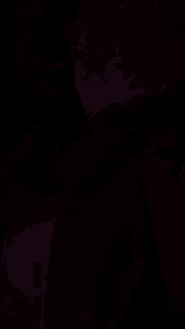 a close up of a person 's face in a dark room with the word vix oil on the bottom
