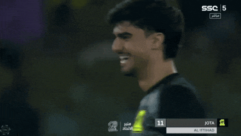 a soccer player is smiling in front of a screen that says ssc 5 on it