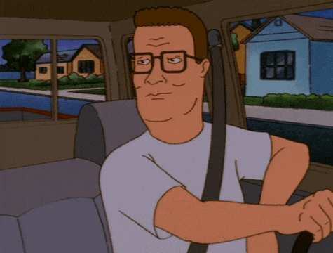 a cartoon character wearing glasses and a white shirt is sitting in a car