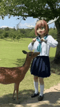 a girl with antlers is standing next to a deer in a field