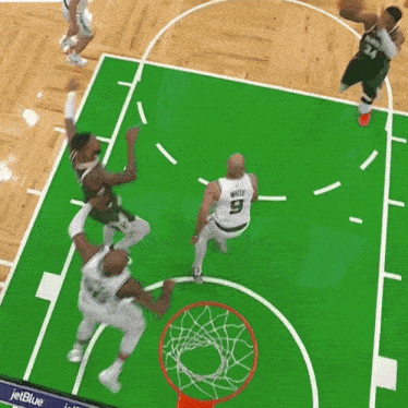 a basketball game is being played with a jetblue ad on the side