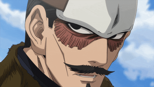 a close up of a man 's face with a white mask on