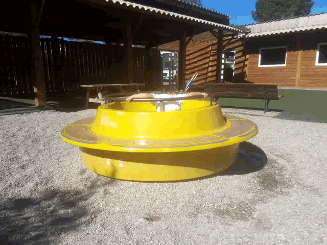 a person is sitting on a yellow circular object