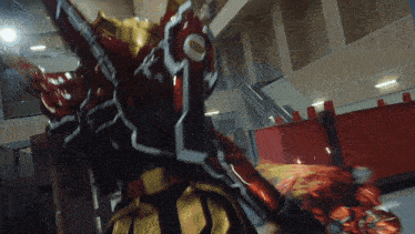a person in a red and gold costume with the number 1 on their chest
