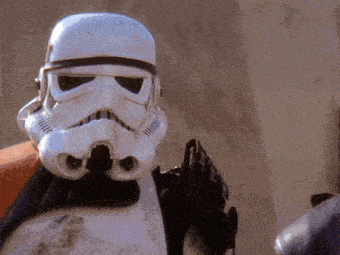 a close up of a storm trooper 's helmet and arms
