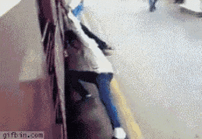 a gif from gifbin.com shows a person sitting on a sidewalk