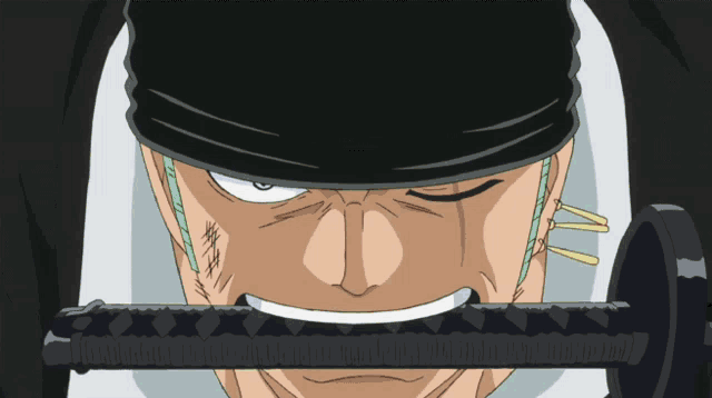 a close up of a man 's face with a black hat