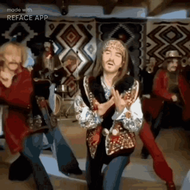 a group of people are dancing in a room with a native american rug in the background .
