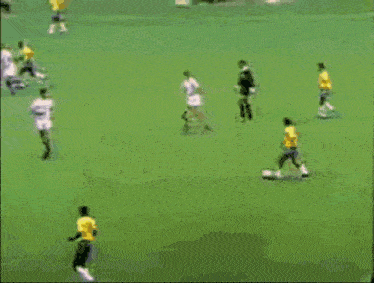 a soccer game is being played on a field with a philips sign in the background