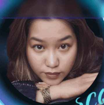 a woman wearing a watch is in a circle with the letters scg
