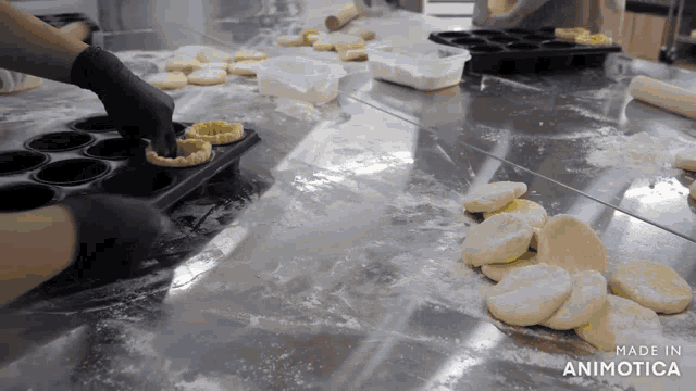 a bunch of dough on a table that says made in animotica on the bottom
