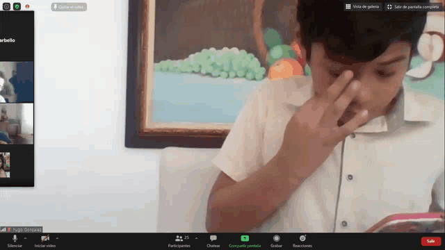 a screen shot of a video call with a boy covering his eyes
