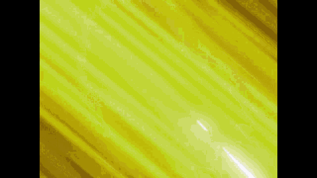a white light is coming out of a yellow background