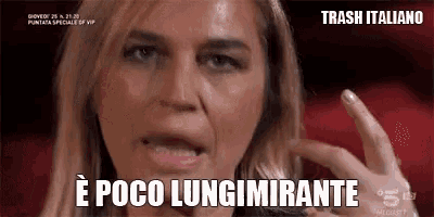 a close up of a woman 's face with the words `` e poco lungimirante '' written on the bottom .