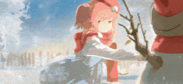 a girl is kneeling next to a snowman in the snow