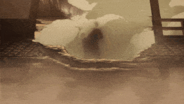 a silhouette of a person standing in a hole in a wall