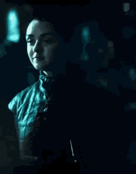 a close up of a person in a dark room