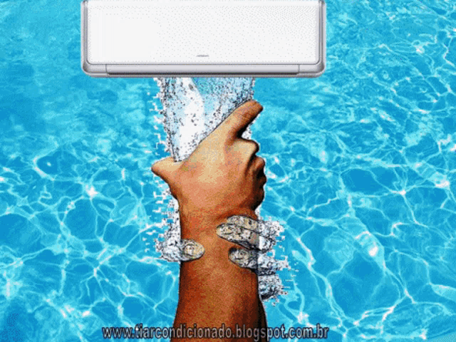 a hand is reaching out towards a hitachi air conditioner in a pool