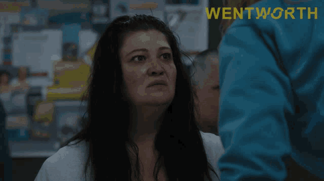 a poster for wentworth shows a woman in a white robe