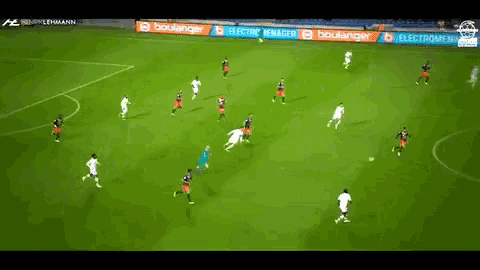 a soccer game is being played on a field with advertisements for electromenager and boulanger .