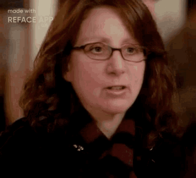 a woman with glasses is making a funny face .