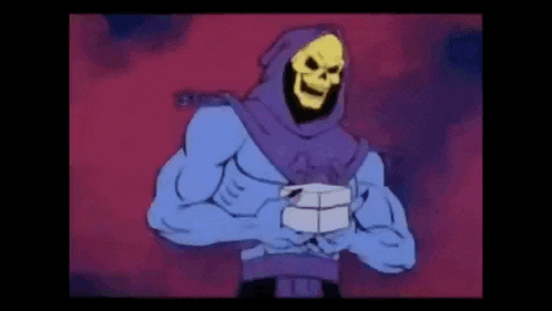 skeletor from the masters of the universe is holding a piece of paper in his hand .
