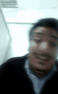 a blurry picture of a man with a mustache
