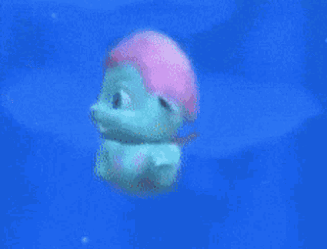 a cartoon character is swimming in a blue pool