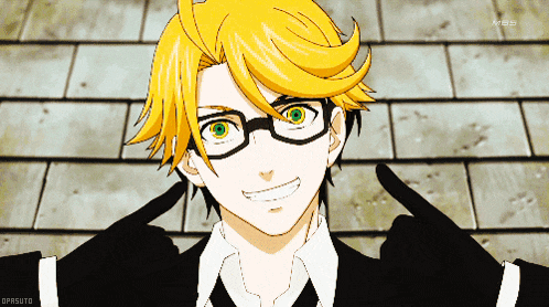 a man with yellow hair and glasses is smiling and pointing at his face