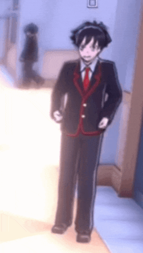 a man in a suit and tie is standing in a hallway with a blurred background .