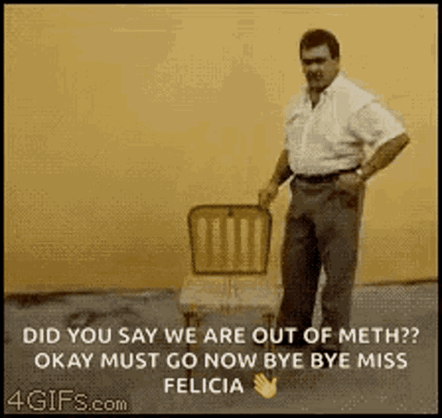 a man is standing next to a chair that says " did you say we are out of meth ? " .