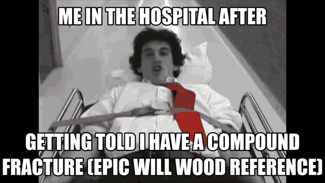 a man in a hospital bed with a red tie and a caption that says me in the hospital after